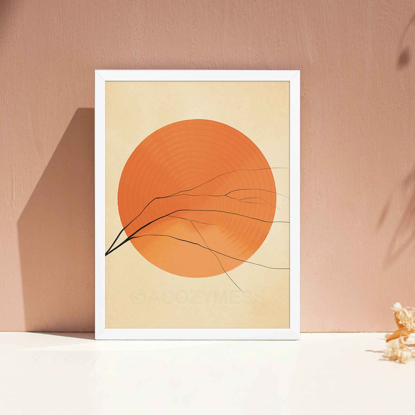 A white-framed abstract wall art poster featuring a vibrant orange sun with clean, minimalist lines. The warm earthy tones create a sense of balance and positivity, making it ideal for living room or as office wall art.