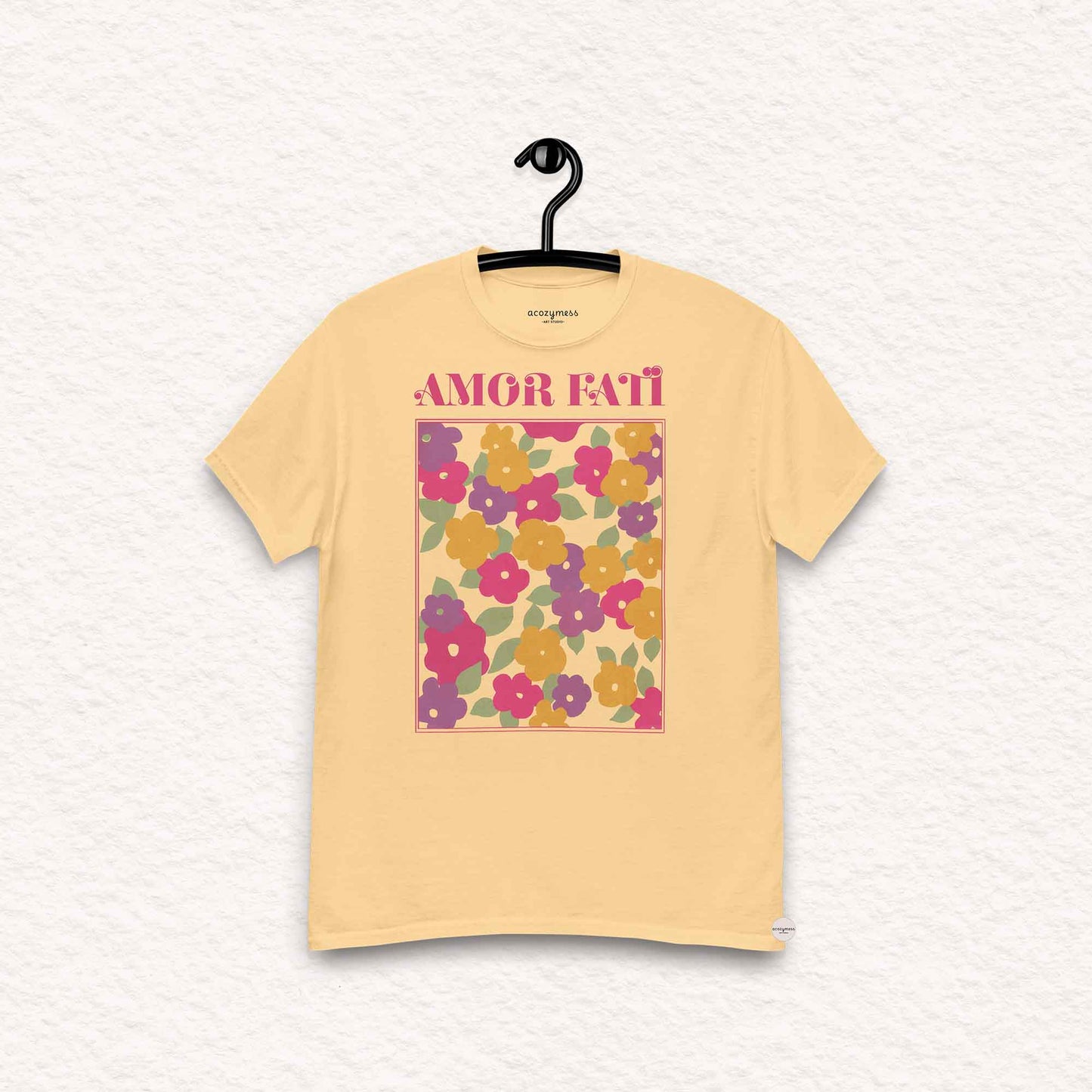 Amor Fati tshirt with pink floral abstract design in light yellow color