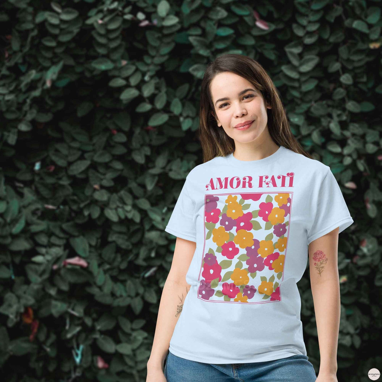 Amor Fati tshirt with pink floral abstract design in light blue color