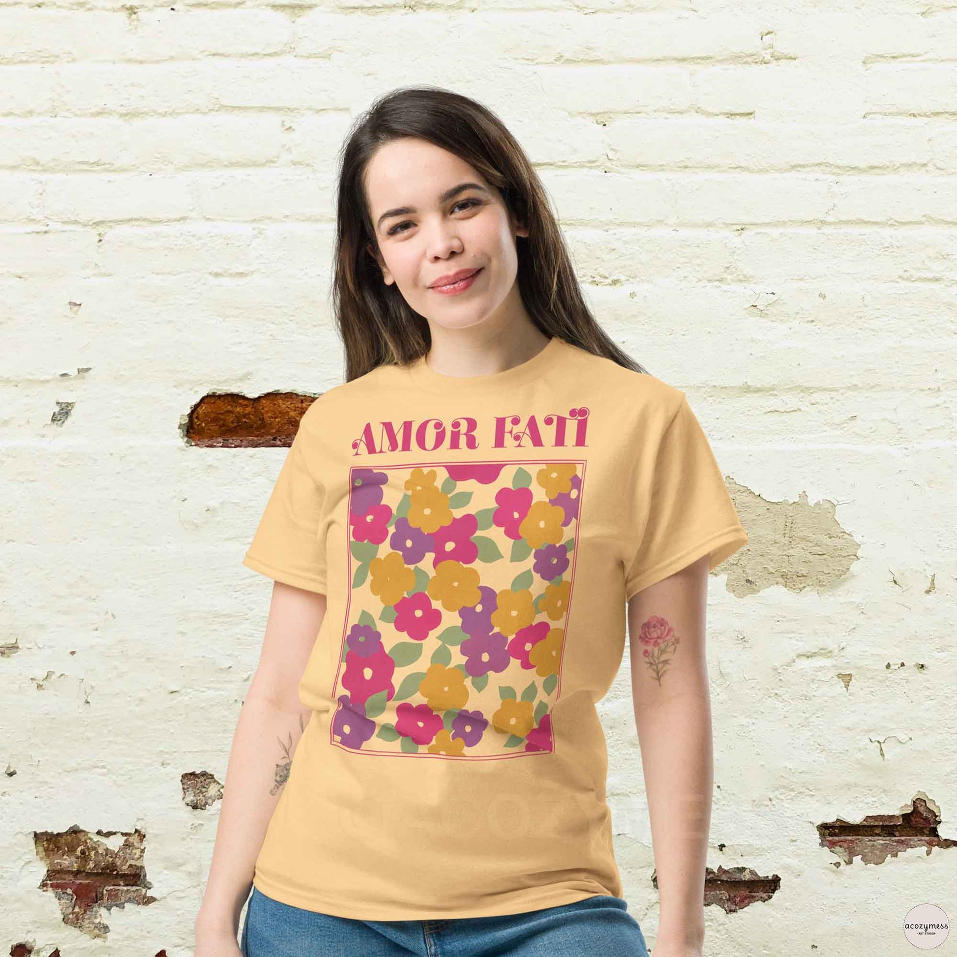 Amor Fati tshirt with pink floral abstract design in light yellow color