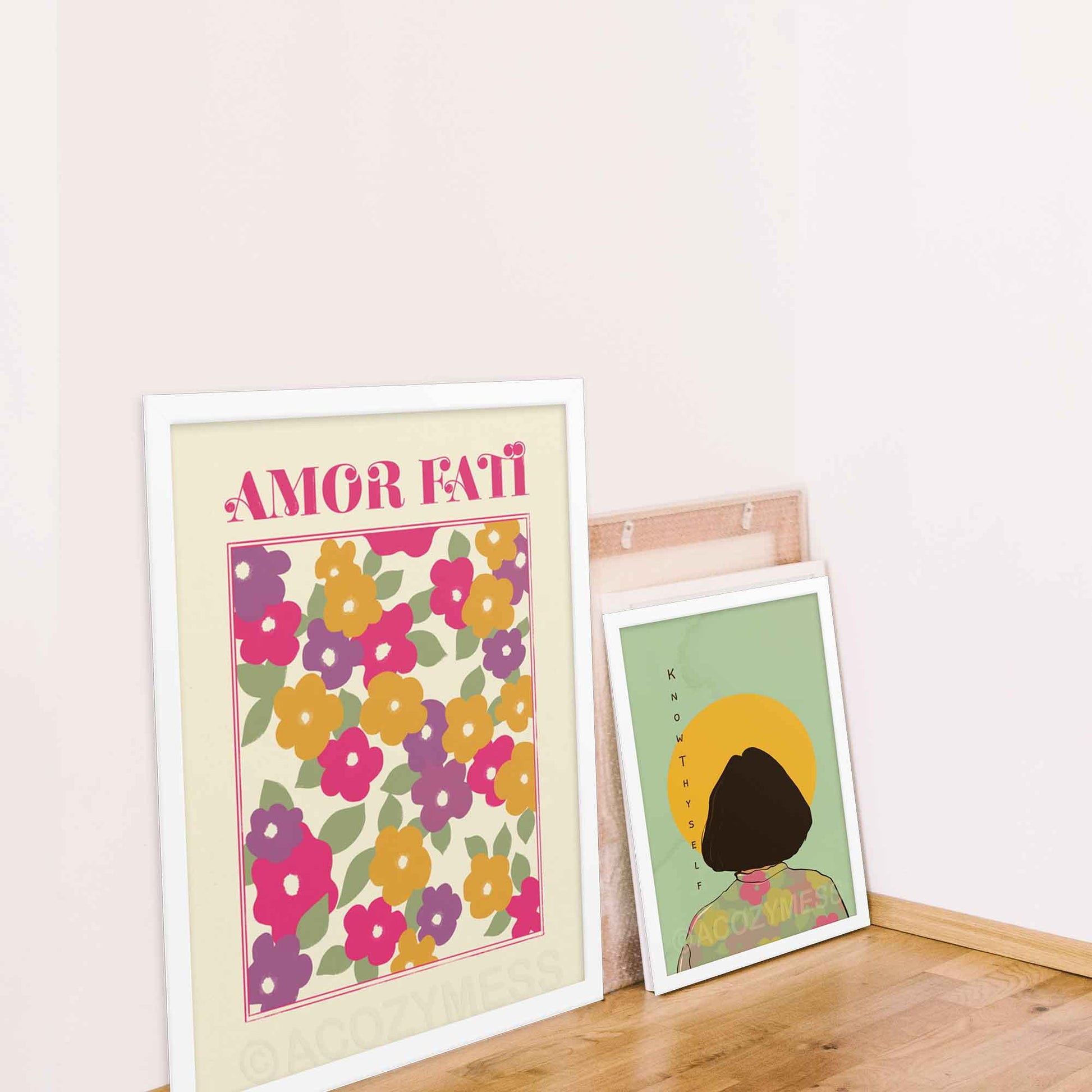 Poster of Abstract Floral Design  featuring pink, purple, yellow, and green hues in an abstract floral arrangement on a light beige background, with the phrase Amor Fati; and know thyself poster with women illustration, in white frame