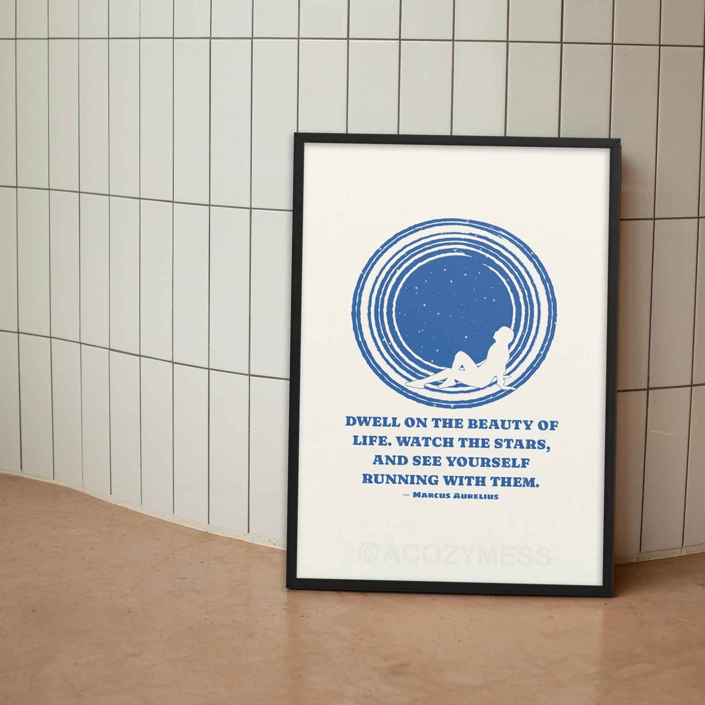 Marcus Aurelius poster with quote on beauty of life with an illustration of star gazing in blue and white colors, in black frame.