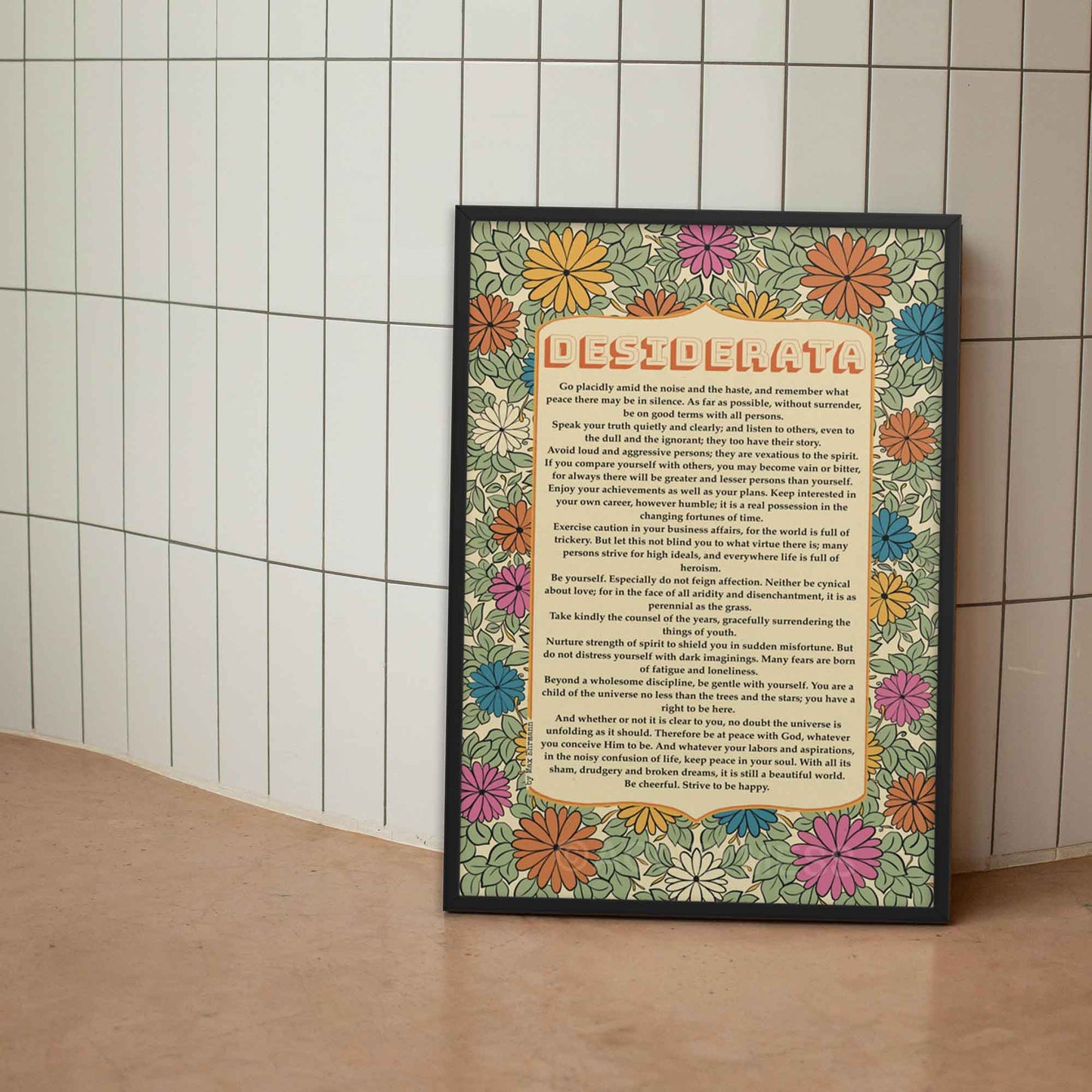 Desiderata poem Print with floral design in soothing colors of sage green, beige, orange and yellow displayed in black frame