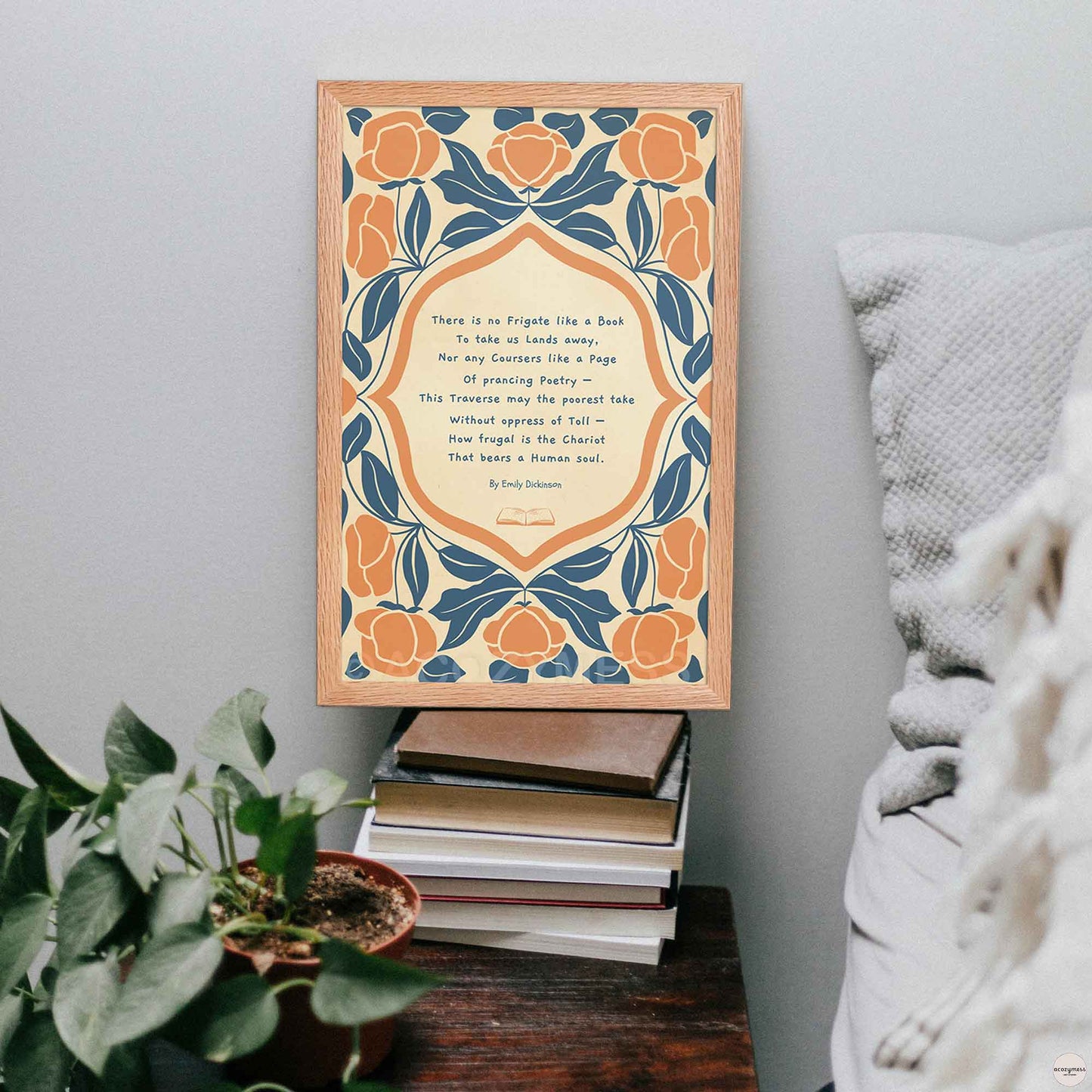A reading poster featuring the Emily Dickinson poem “There is no Frigate like a Book” with elegant abstract floral illustrations on a textured background, in oakwood frame for book lovers.