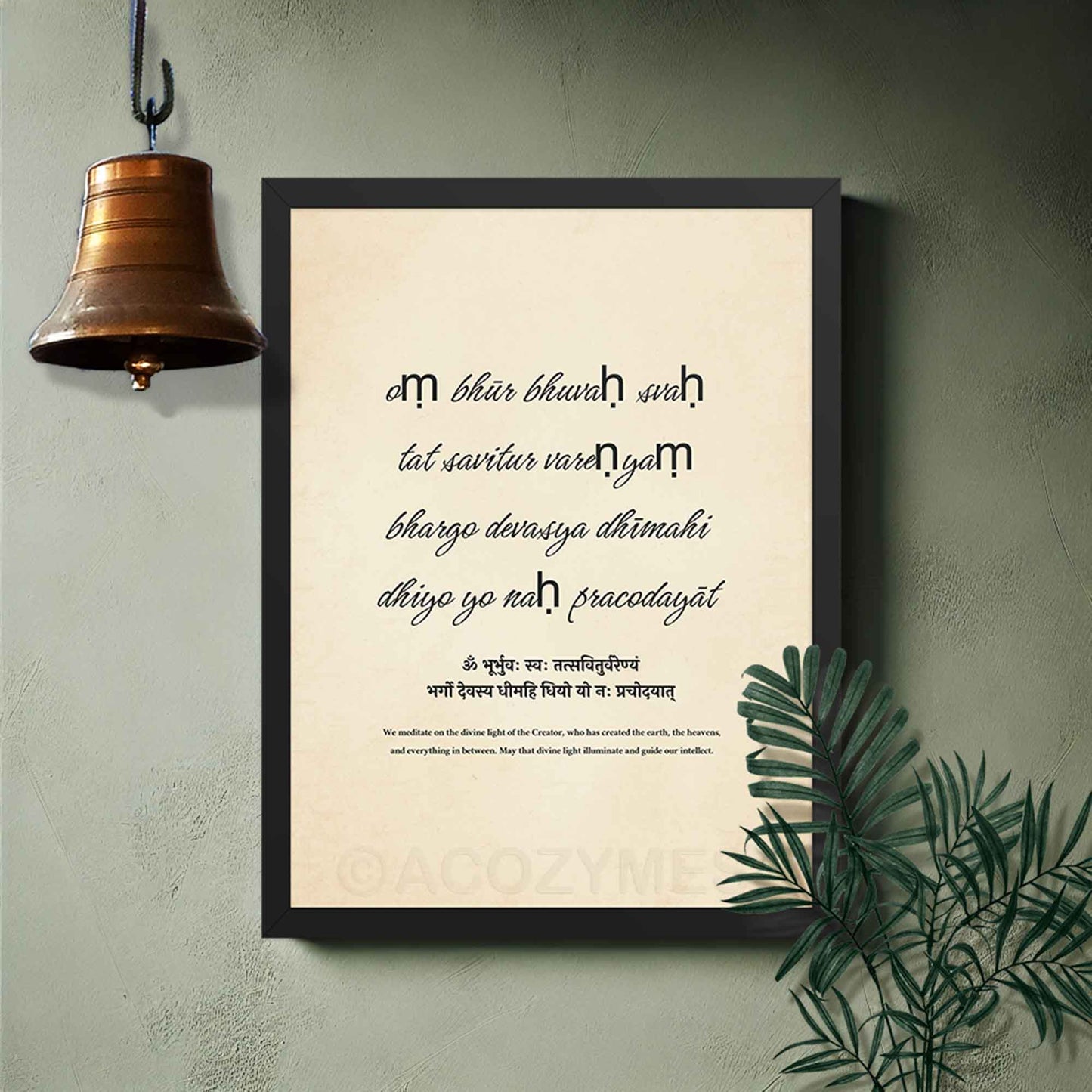 Poster of the Gayatri Mantra in a sleek black frame, on a puja room wall