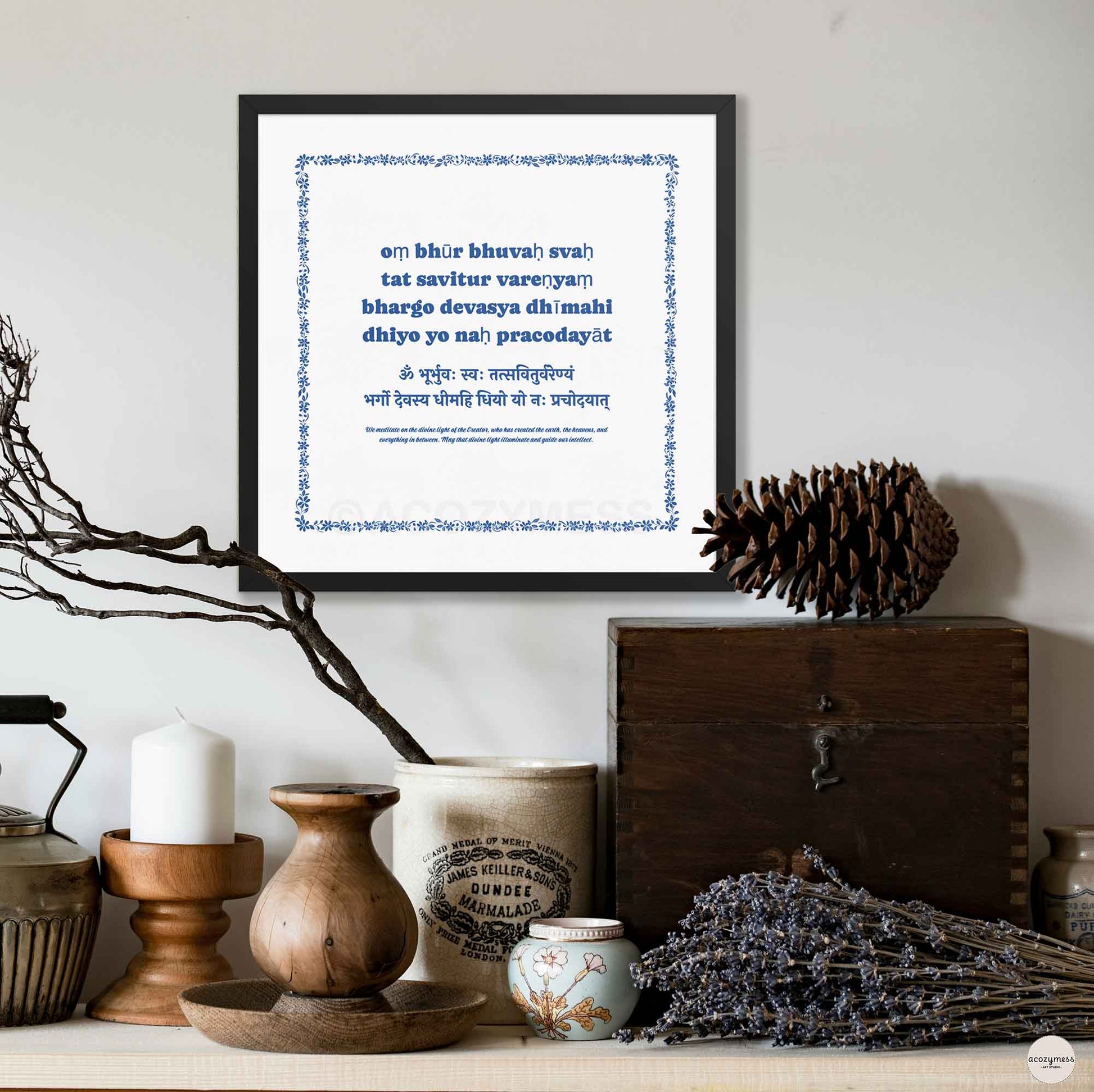 Gayatri Mantra poster blue on white in a sleek black frame, offering a bold contrast.