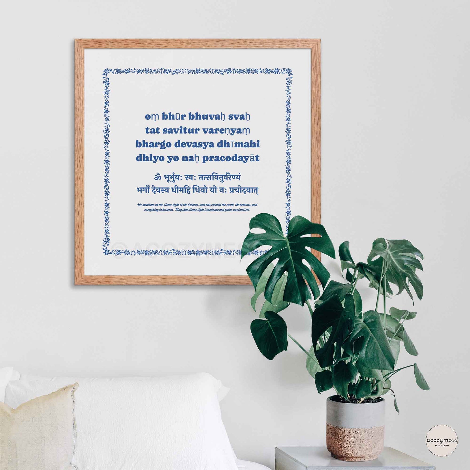 Gayatri Mantra poster in blue and white framed in oakwood, adding a warm and natural touch.