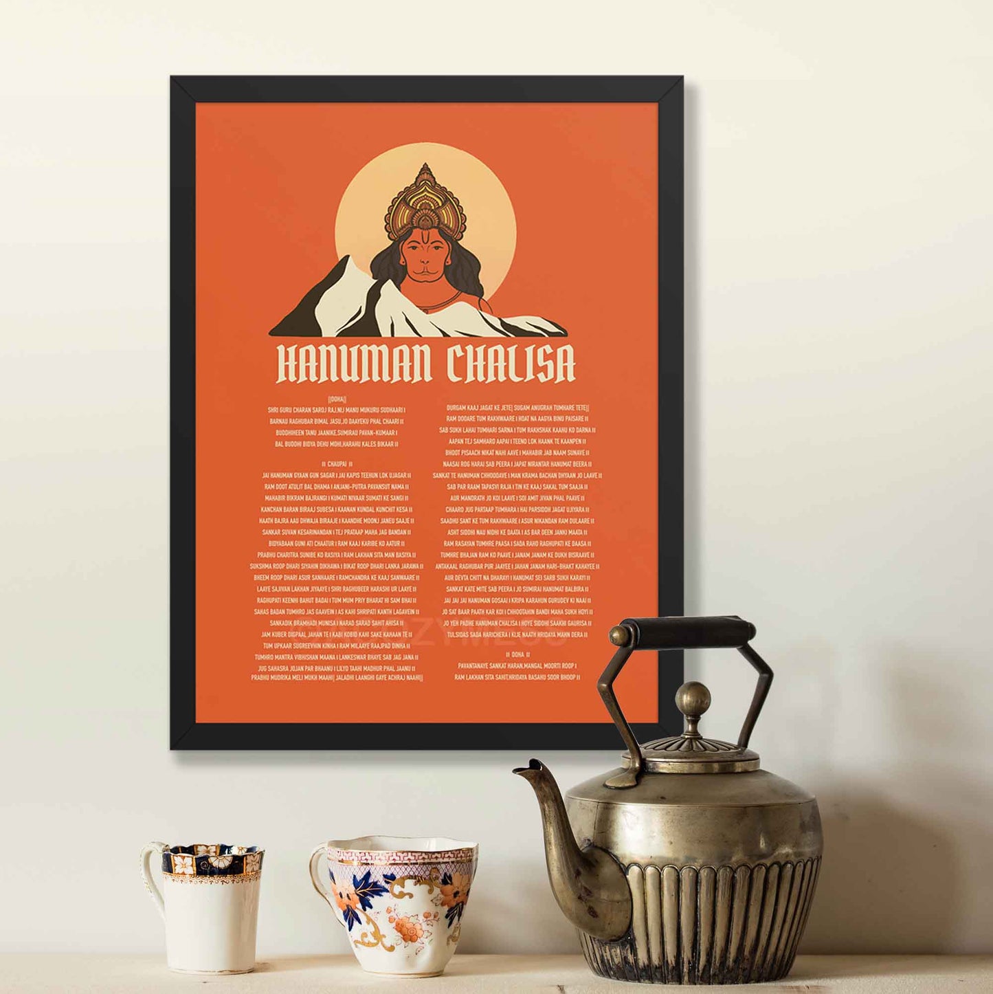 A devotional Hanuman Chalisa poster featuring an illustration of Lord Hanuman on a vibrant orange background, symbolizing strength, devotion, and spiritual power. The sacred verses of the Hanuman Chalisa are elegantly displayed, in black frame.