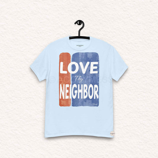 Light blue t-shirt with 'Love Thy Neighbor' graphic on a hanger against a light background