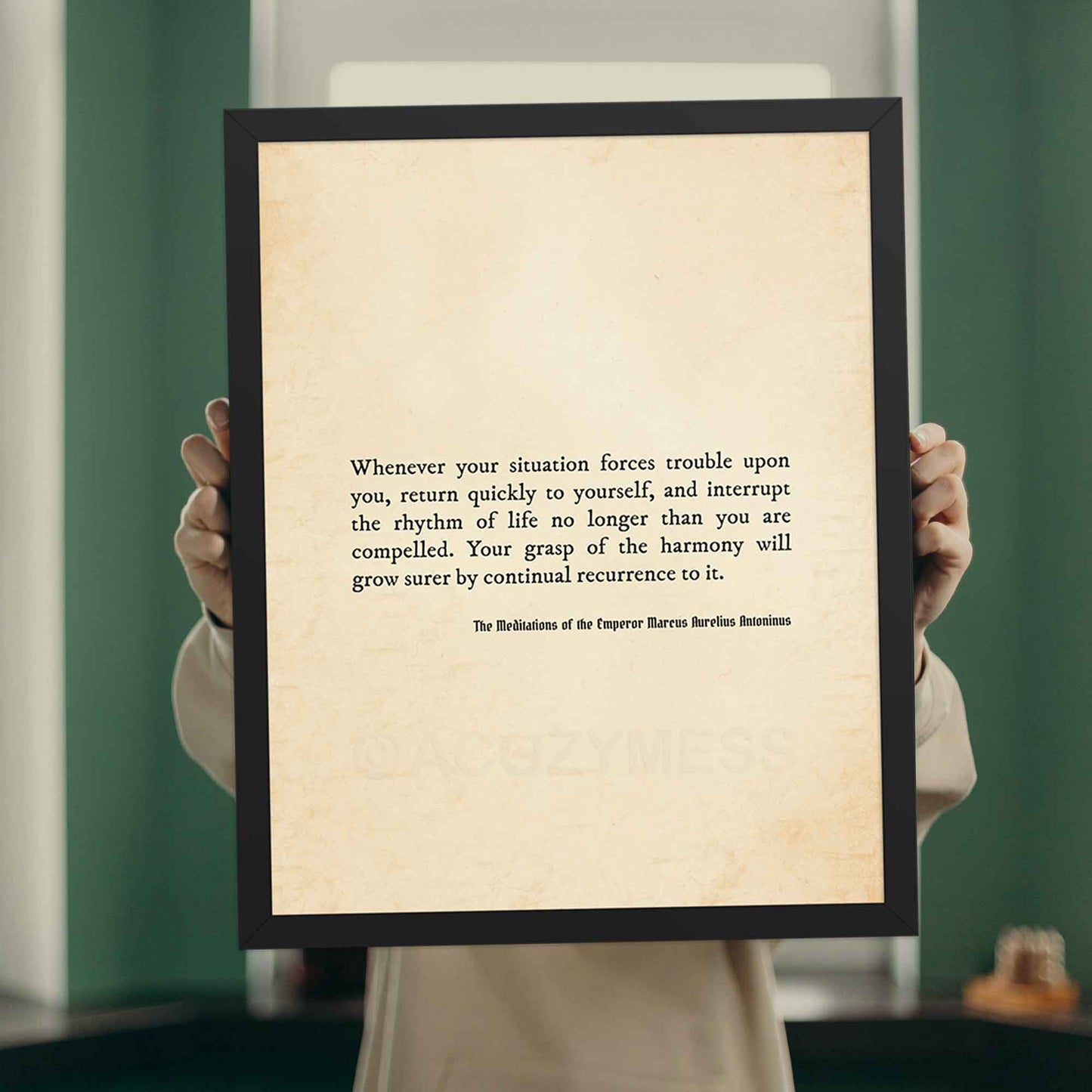 Stoic Philosophy poster in black frame featuring Marcus Aurelius quote.