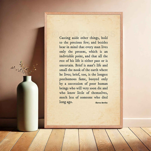 A minimalist typography poster featuring the Marcus Aurelius quote: *"Casting aside other things, hold to the precious few."* The simple, clean design emphasizes clarity, simplicity, and intentional living, perfect for Stoicism and mindfulness enthusiasts, in oakwood frame.