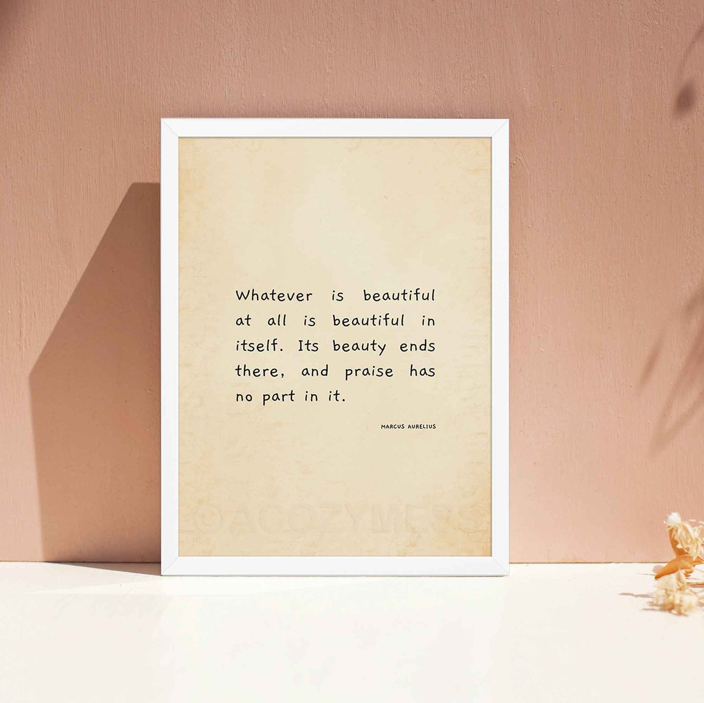 Marcus Aurelius on beauty quote on beige old paper in white frame.