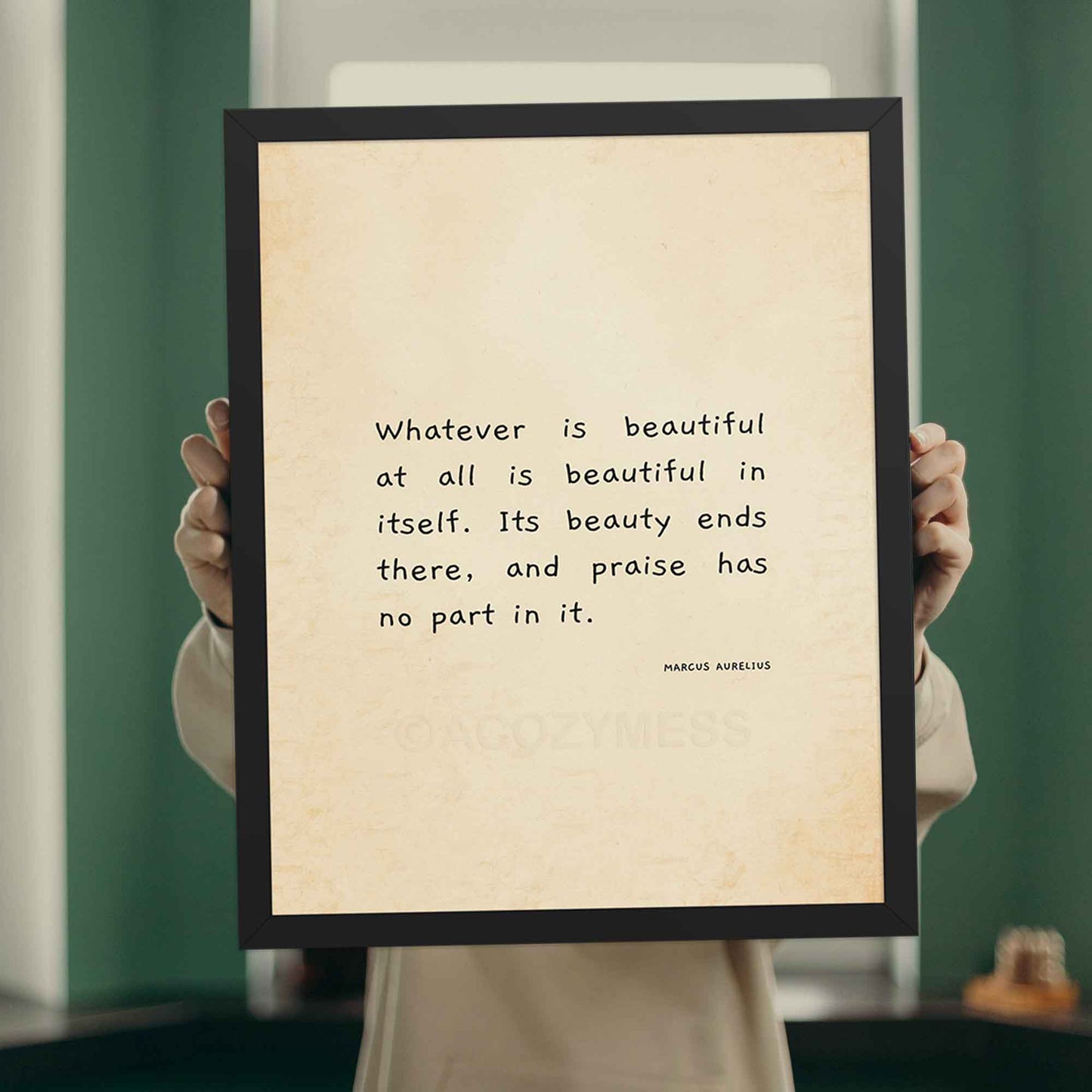 Marcus Aurelius on beauty quote in black frame.