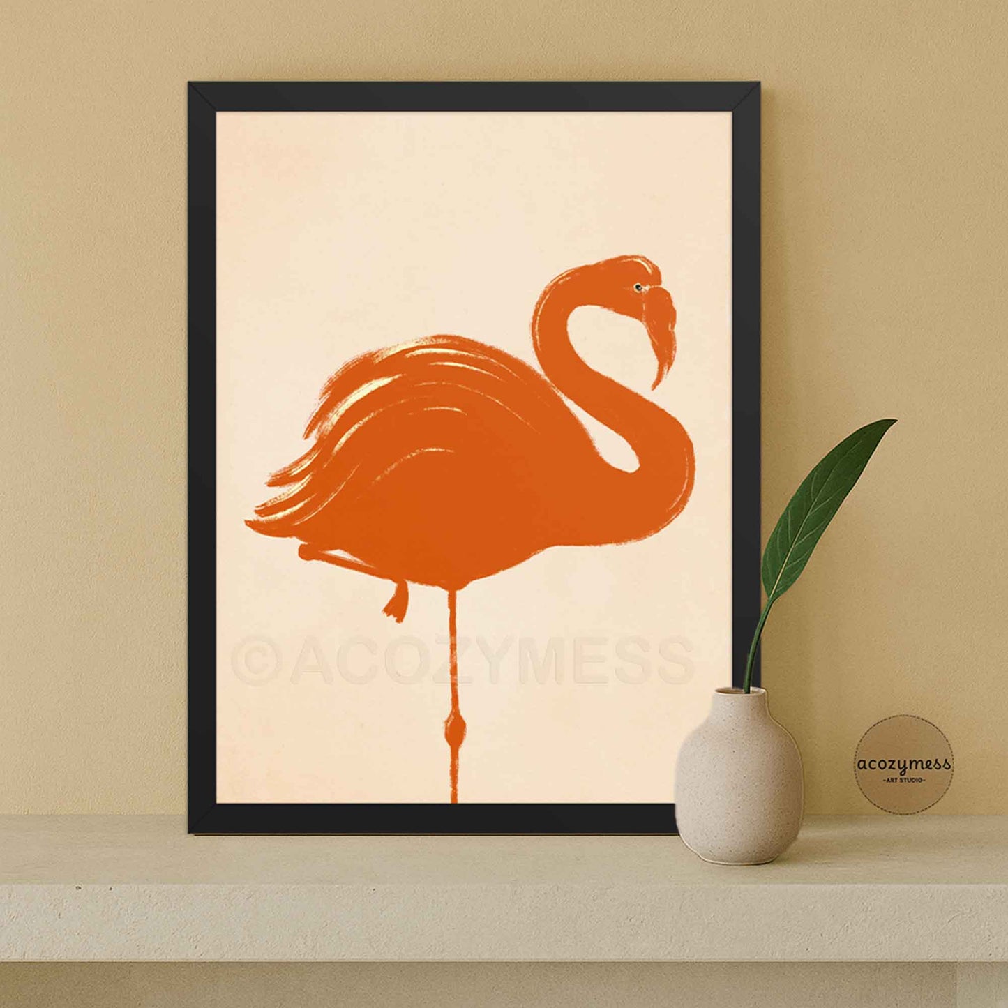 Framed artwork of an orange flamingo on a beige background.