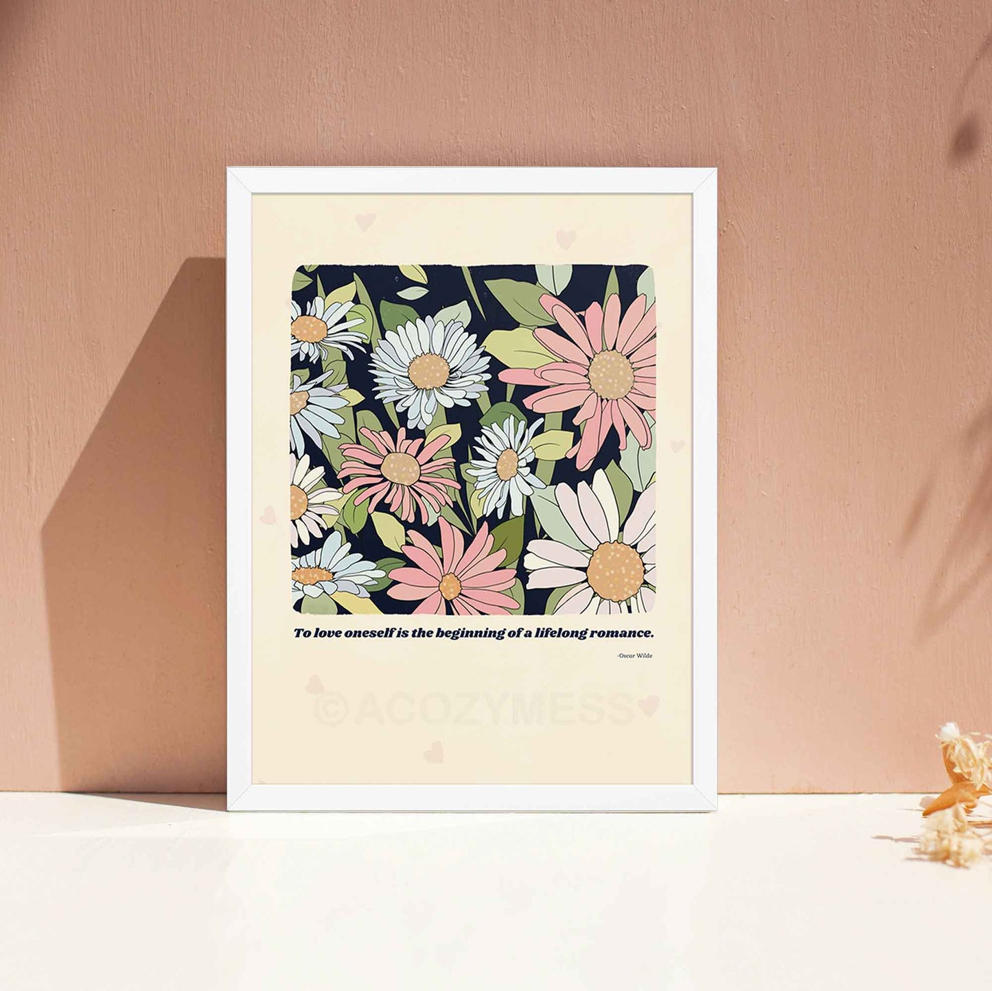 A beautifully designed literature poster featuring Oscar Wilde’s quote, "To love oneself is the beginning of a lifelong romance," paired with a delicate floral illustration, in white frame.