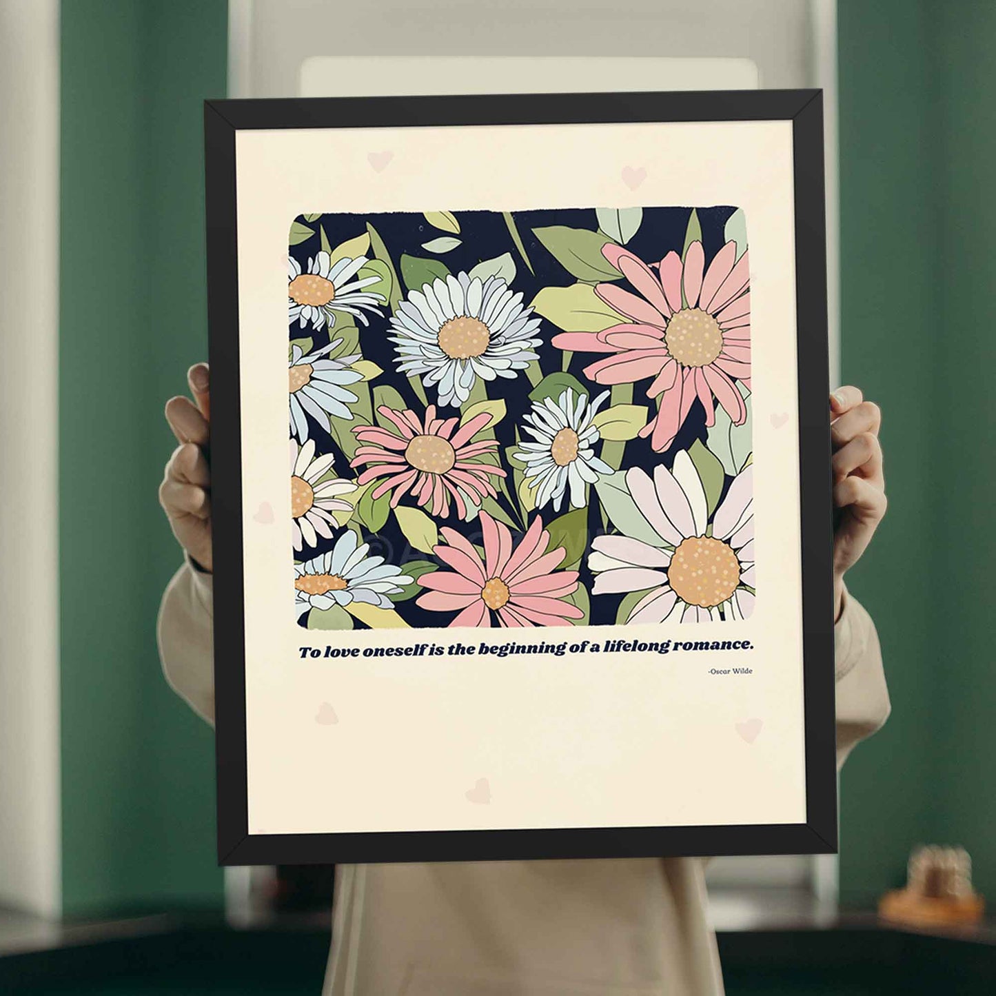A literature poster featuring Oscar Wilde’s quote, "To love oneself is the beginning of a lifelong romance," paired with a delicate flower illustration, in black frame.