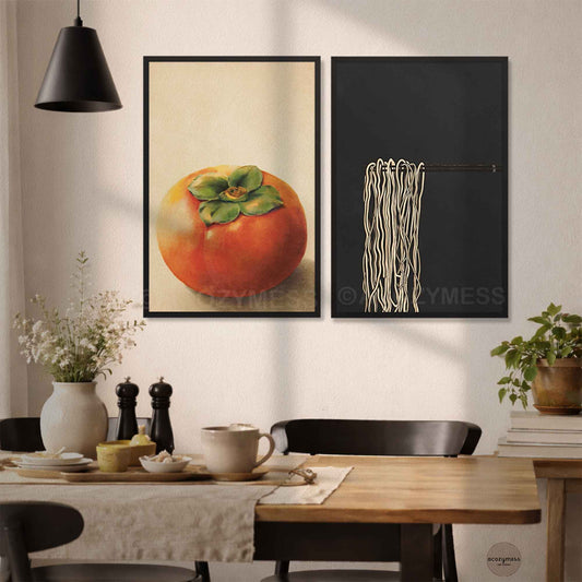 Dining room featuring two framed artworks of persimmon and ramen art minimalist style on the wall.