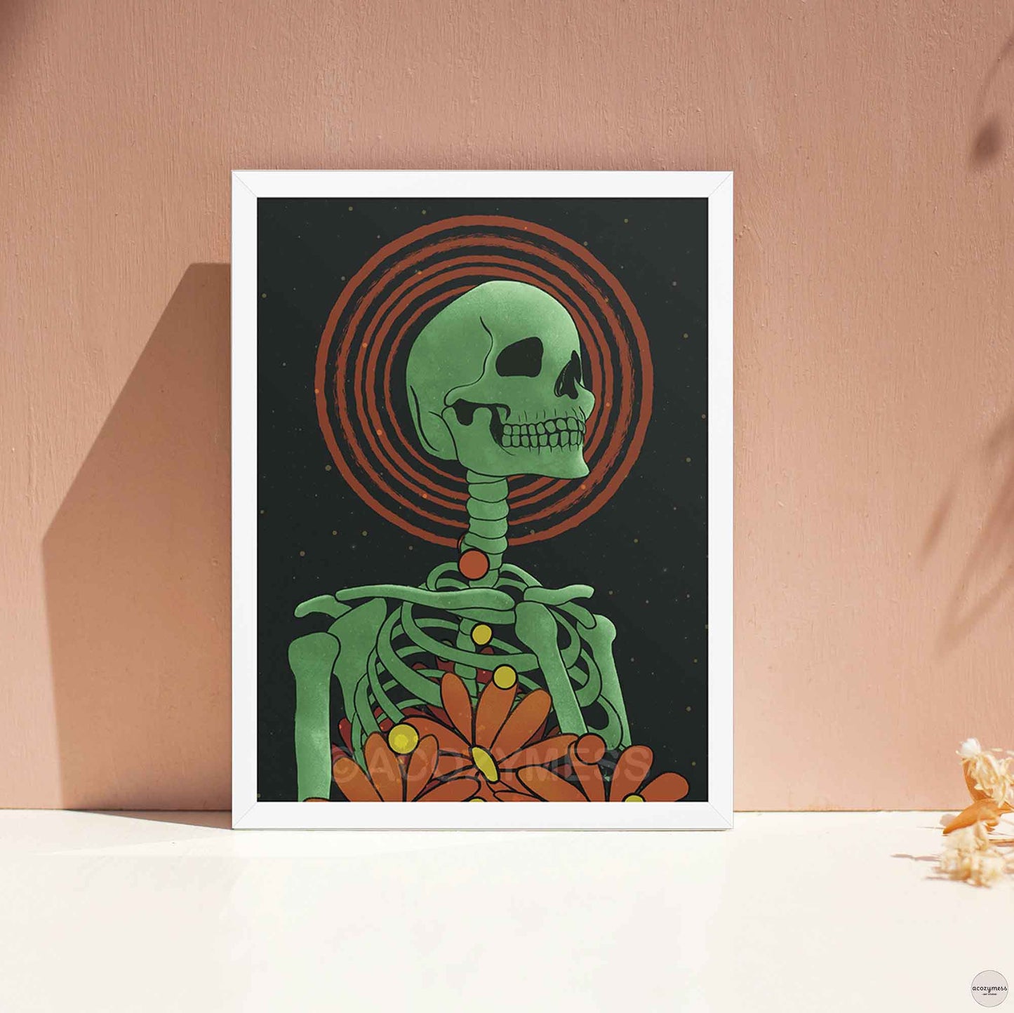 Whimsical green skeleton and floral art in white frame, adding light contrast to the dreamy night sky theme.