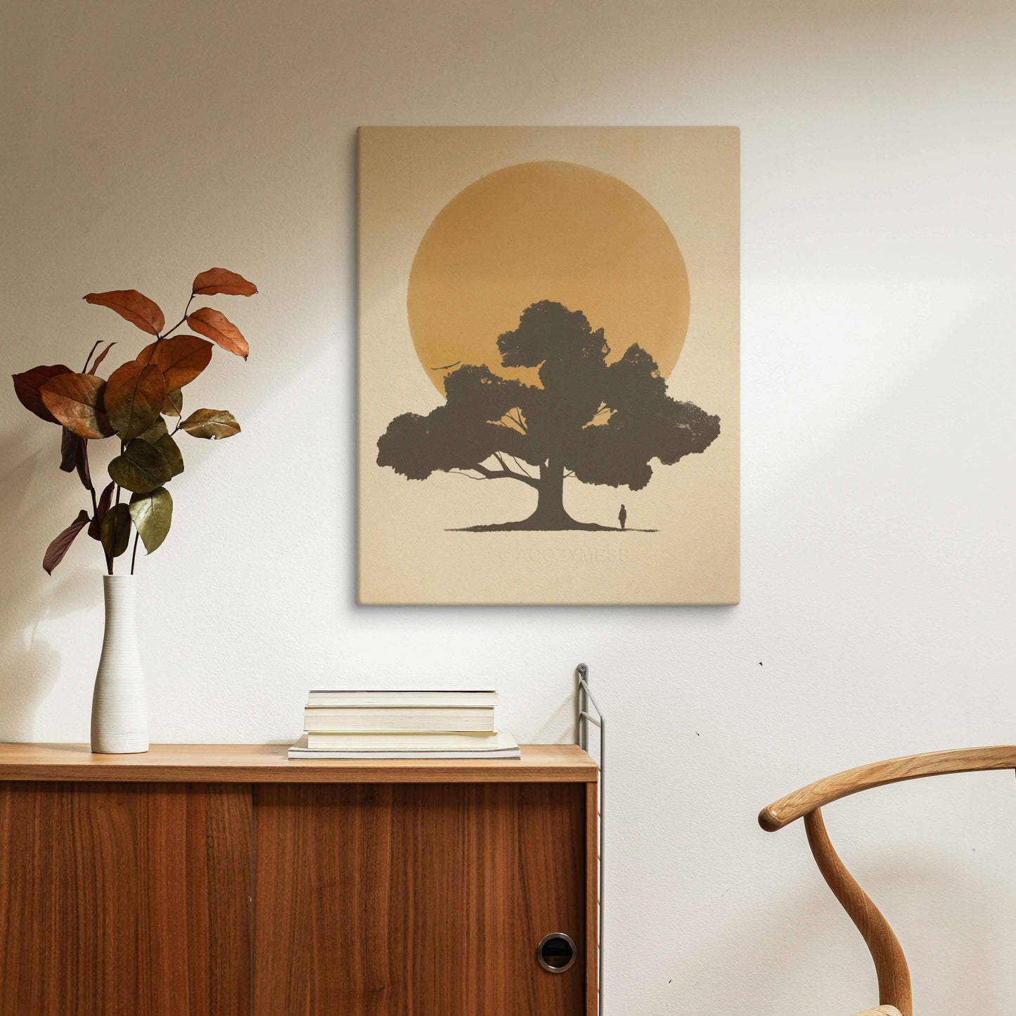 silhouette of a tree and a person in front of sun in yellow color canvas artprint.