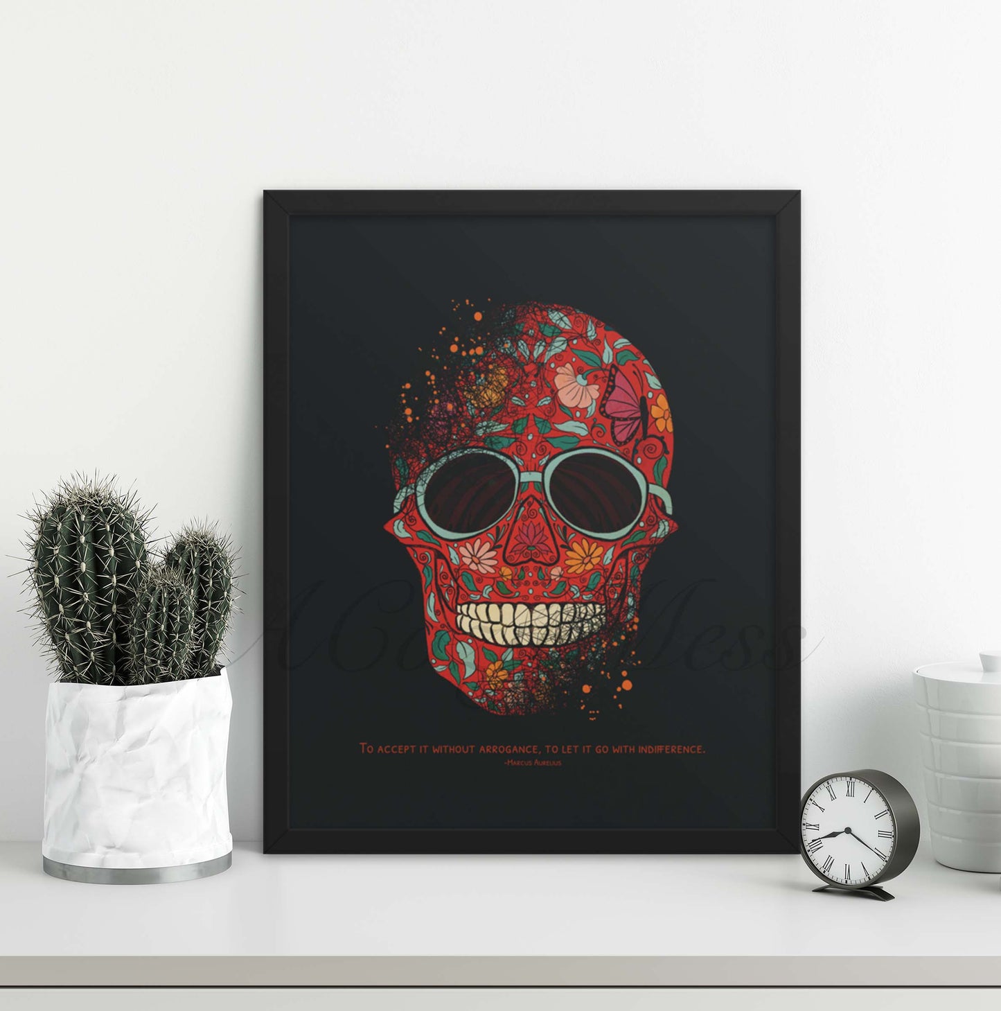 A striking art poster depicting a skull richly decorated with red and orange floral designs against a dark background, wearing round, black sunglasses. Below the skull is a quote from Marcus Aurelius in white font that reads, "To accept it without arrogance, to let it go with indifference, in black frame.