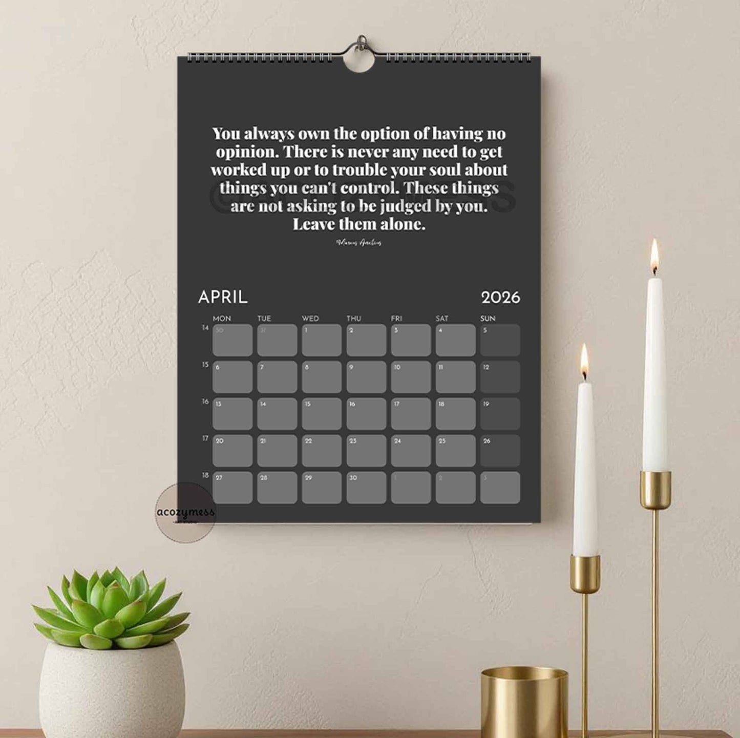 Wall calendar with stoic motivational quote on a wall