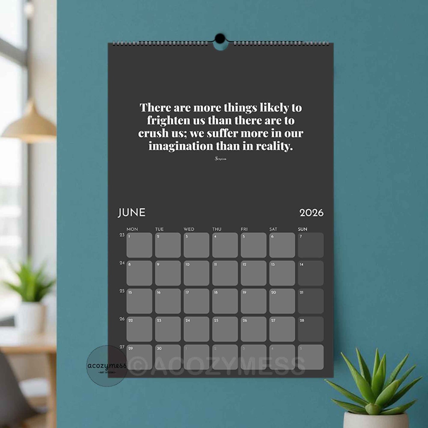 Calendar with a motivational quote on a blue wall