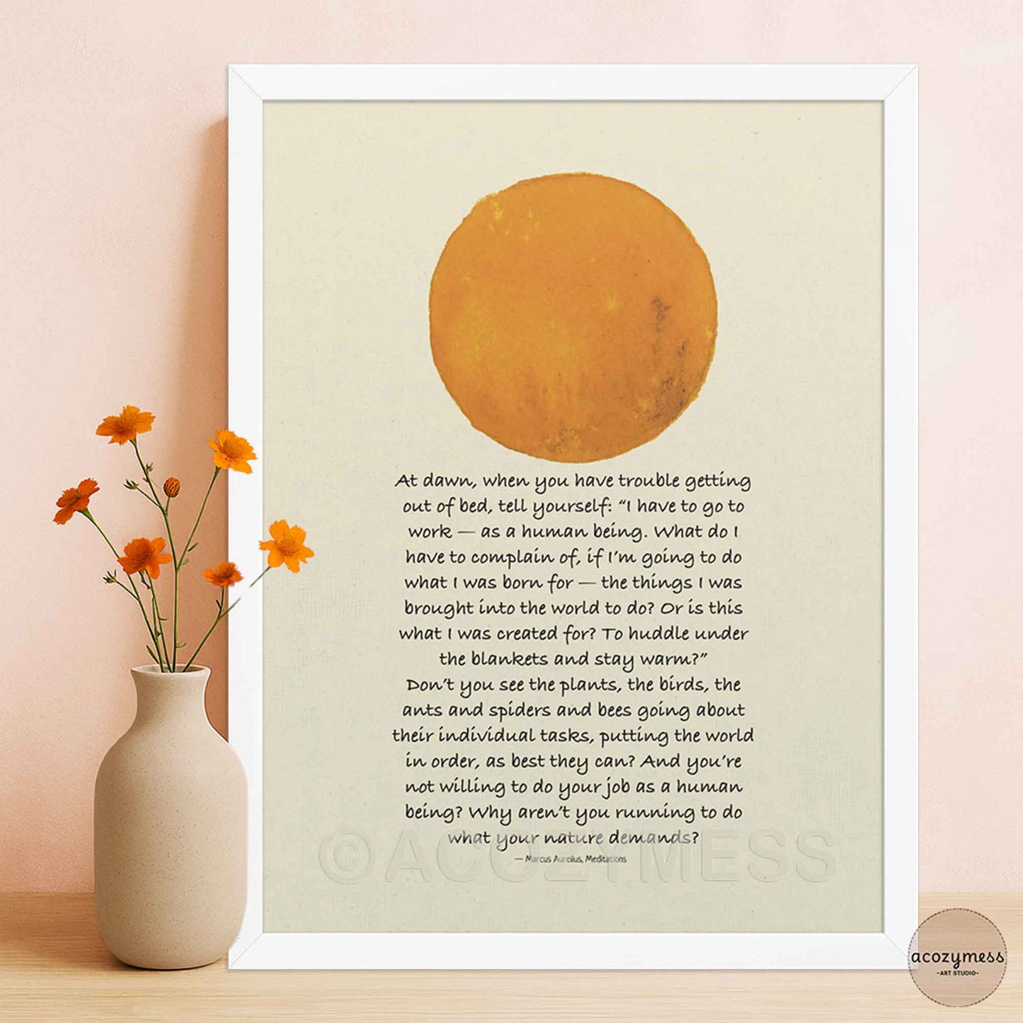 Framed poster in white with inspirational Marcus Aurelius quote and sun design on beige, adding a soft, calming touch.