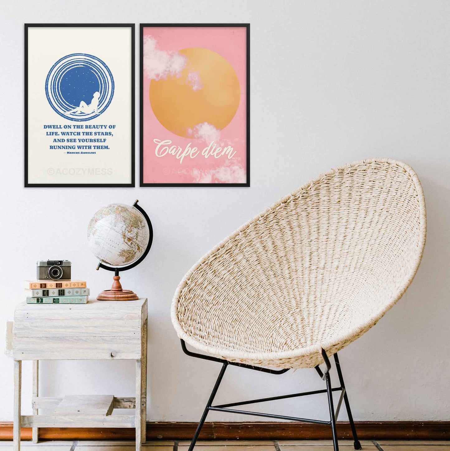 Marcus Aurelius poster with quote on beauty of life with an illustration of star gazing in blue and white colors, in black frame. Carpe diem poster with sun and cloudy pink sky illustration, in black frame.