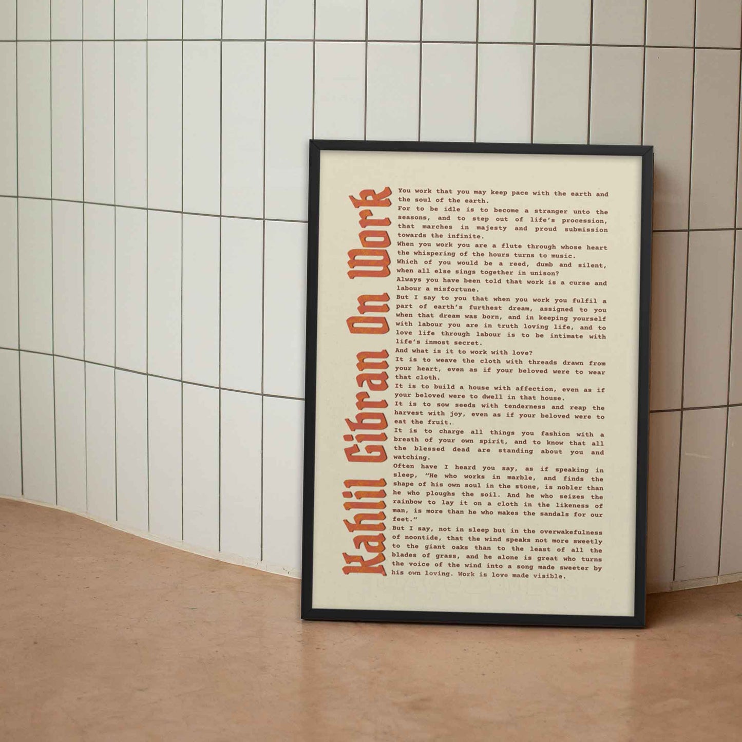 On Work motivational poster by Kahlil Gibran in black frame.