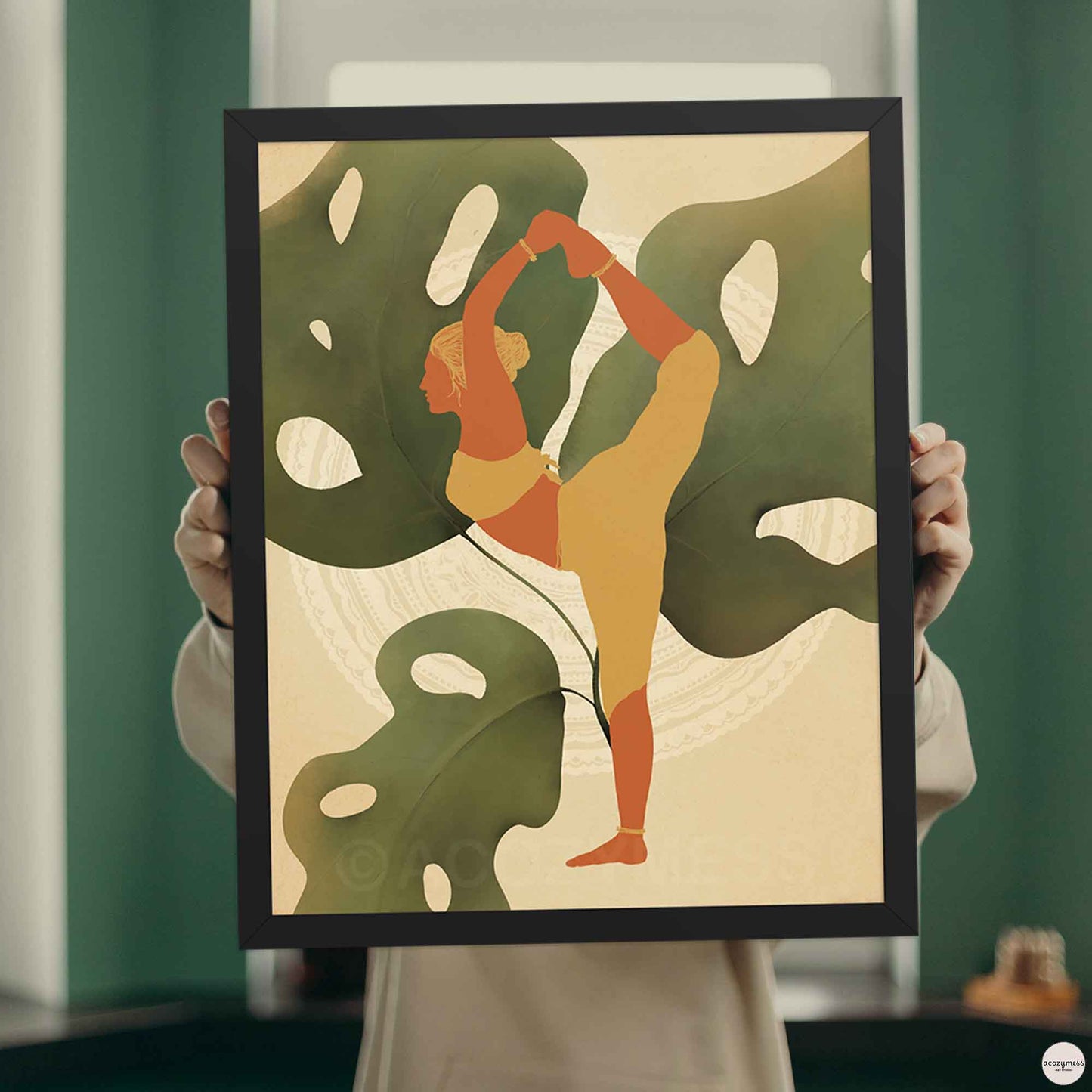 Yoga room wall art of a woman in earthly colors displayed in black frame.