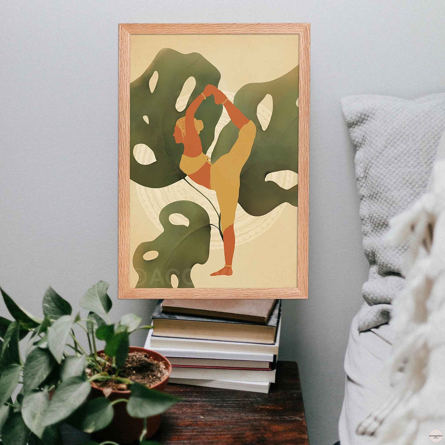 Nature inspired Yoga room wall art of a woman in earthly colors displayed in oakwood frame.