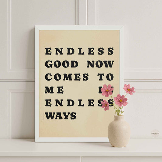 Framed motivational poster with text 'Endless good now comes to me in endless ways' on a beige background, ideal for calm, modern interiors.