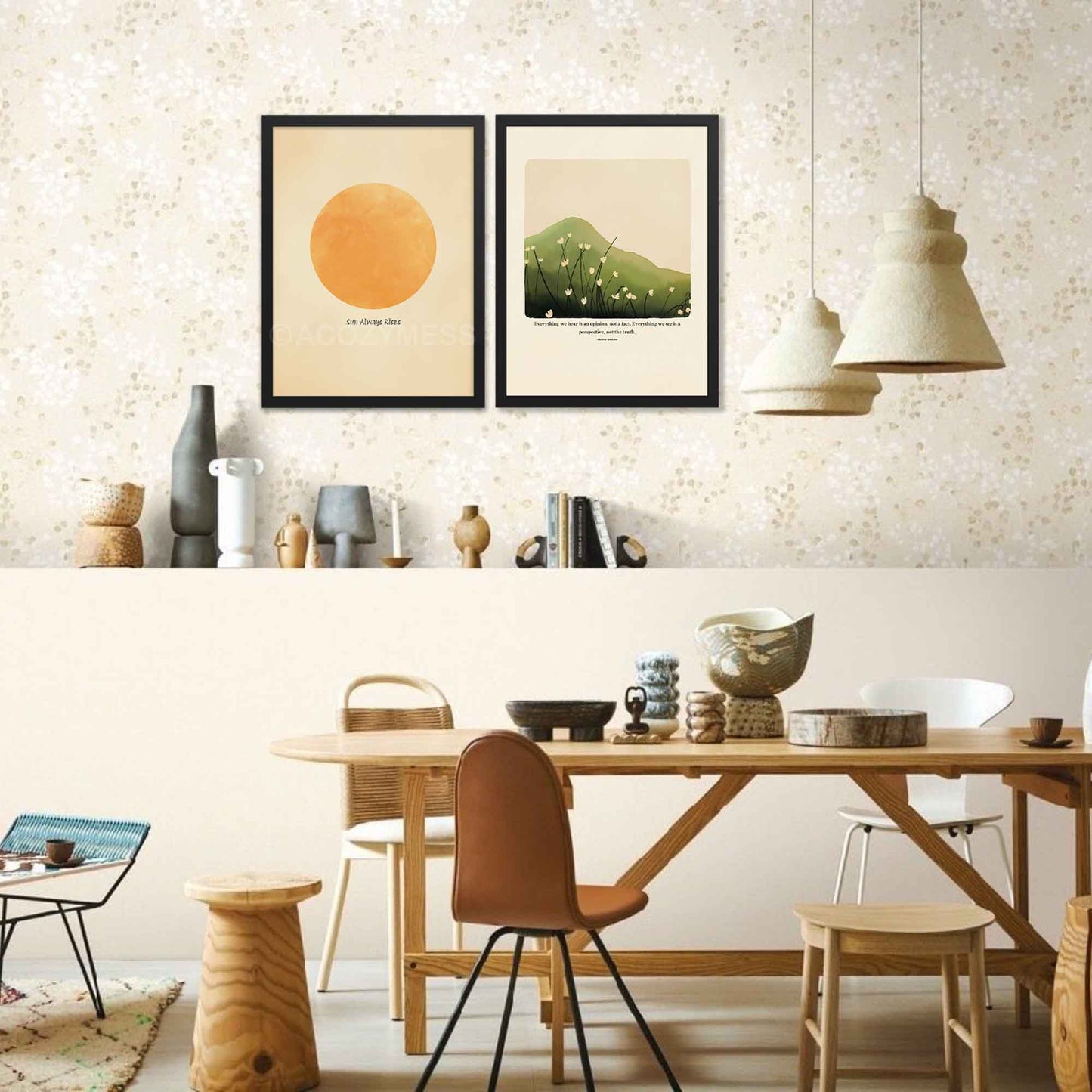 A Marcus Aurelius print in black frame featuring Marcus Aurelius' quote, "Everything we hear is an opinion, not a fact. Everything we see is a perspective, not the truth," along with a serene nature illustration of a green hill or mountain with delicate white flowers.