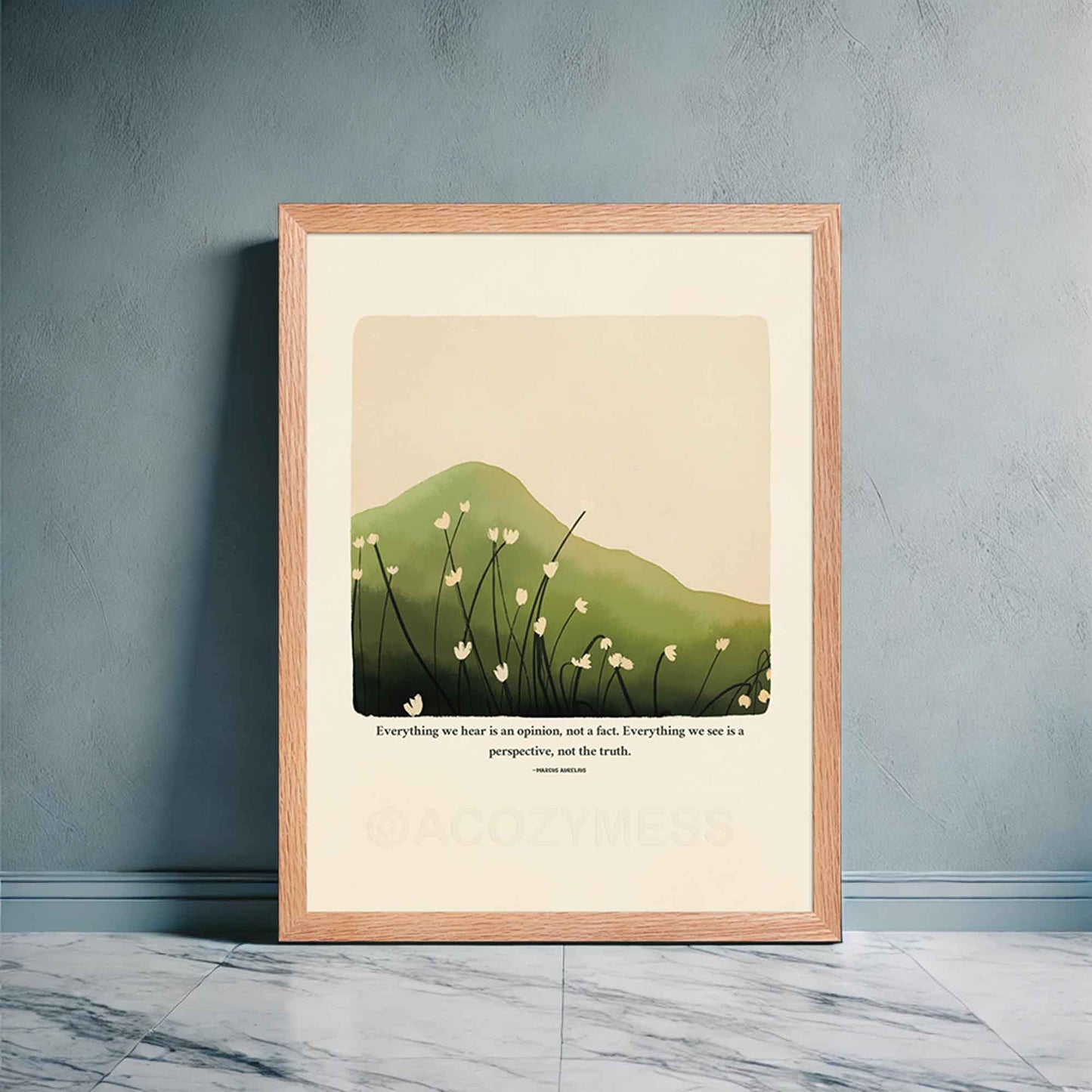 A Marcus Aurelius poster in oakwood frame featuring Marcus Aurelius' quote, "Everything we hear is an opinion, not a fact. Everything we see is a perspective, not the truth," along with a serene nature illustration of a green hill or mountain with delicate white flowers.
