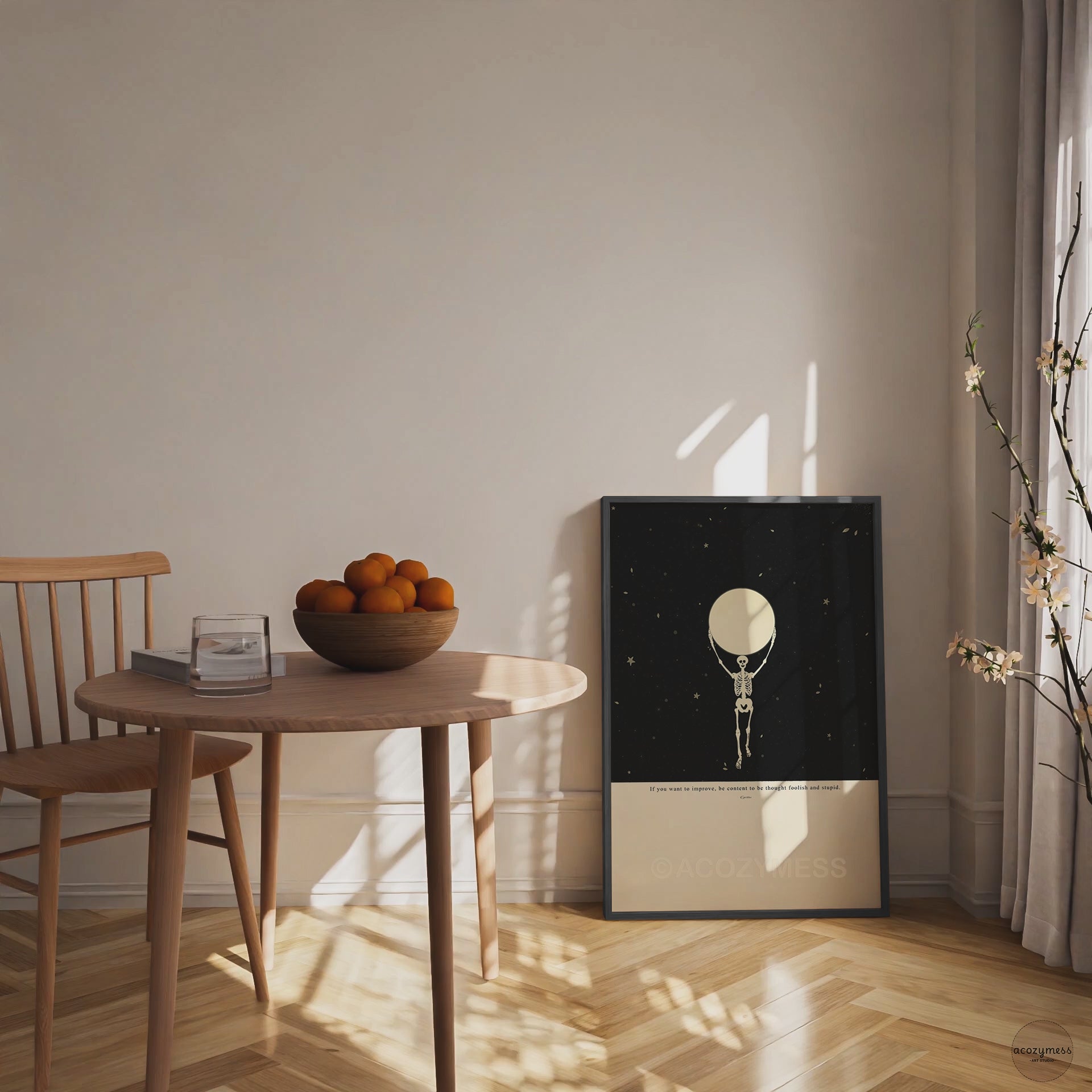 Framed Epictetus quote wall art with skeleton holding the moon illustration on a starry black and beige background, set in a modern black wood frame