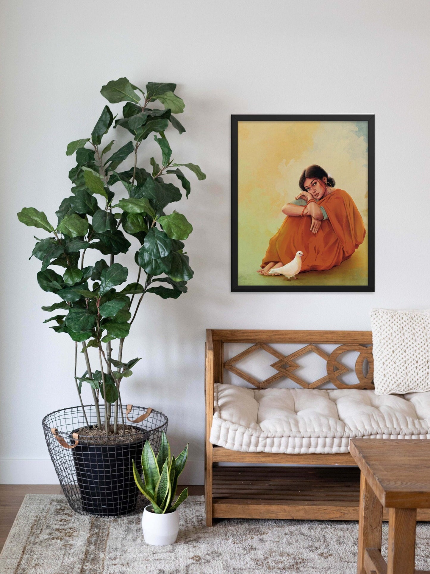 Indian woman sitting in a red saree with white dove wall art poster in oakwood frame displayed on a wall