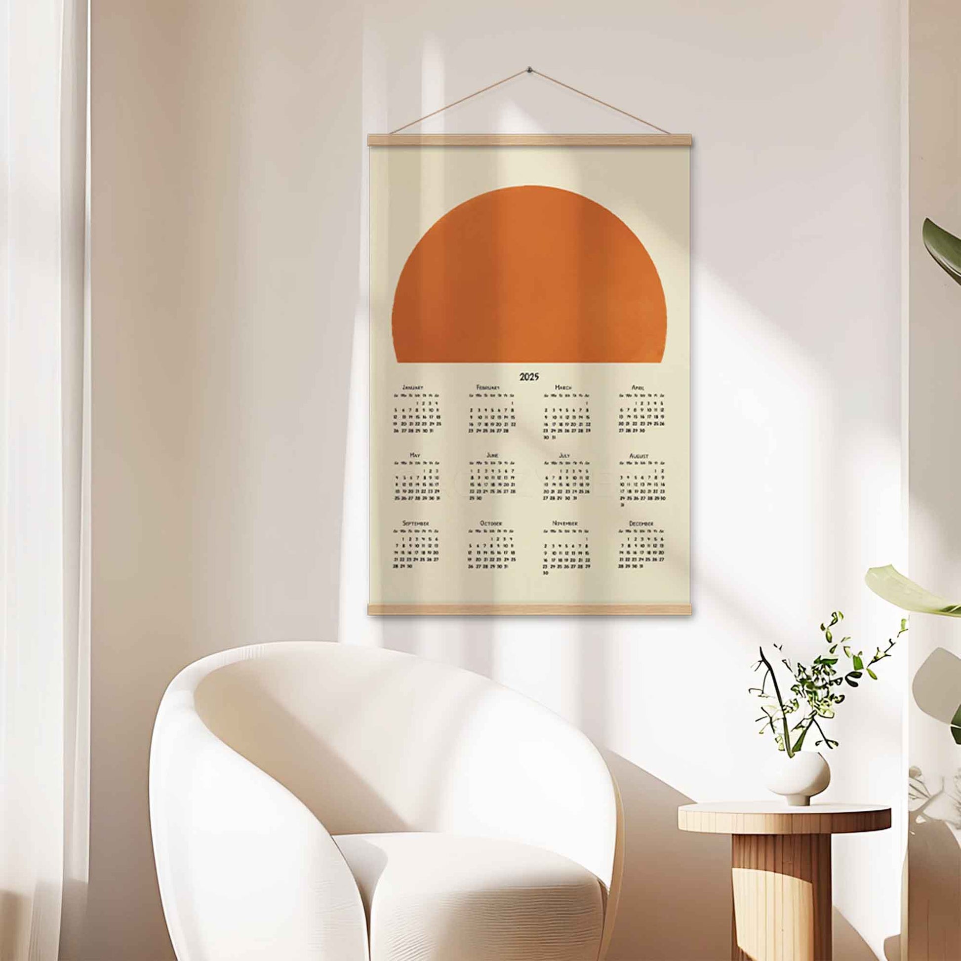 2025 yearly calendar poster with a minimalist sun design, with an oakwood hanger, adding positivity and warmth to your office decor.