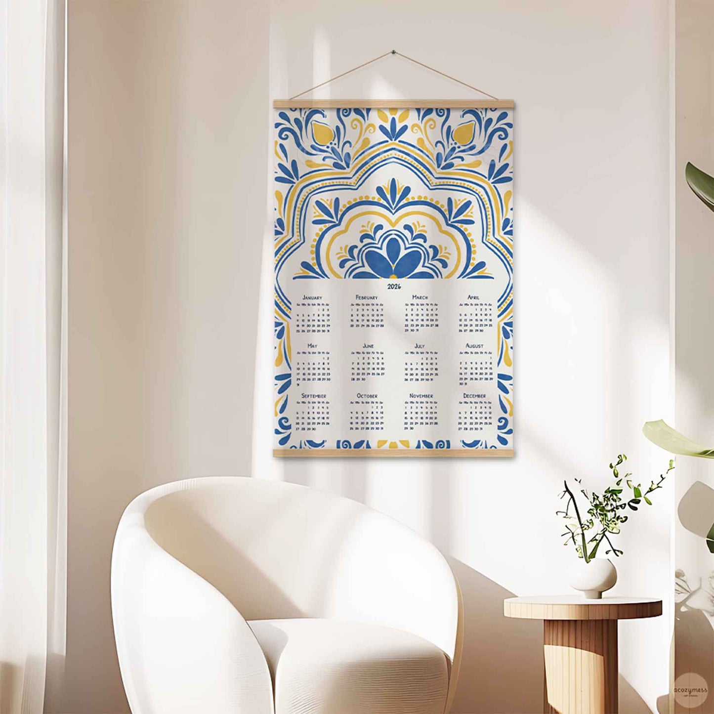 Decorative calendar with blue and yellow pattern hanging on an office wall.