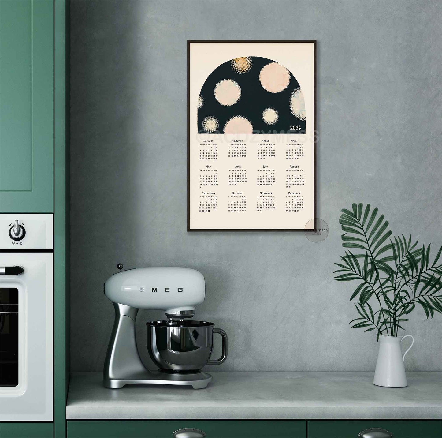 2026 calendar displayed in black frame
 displayed in modern kitchen setting