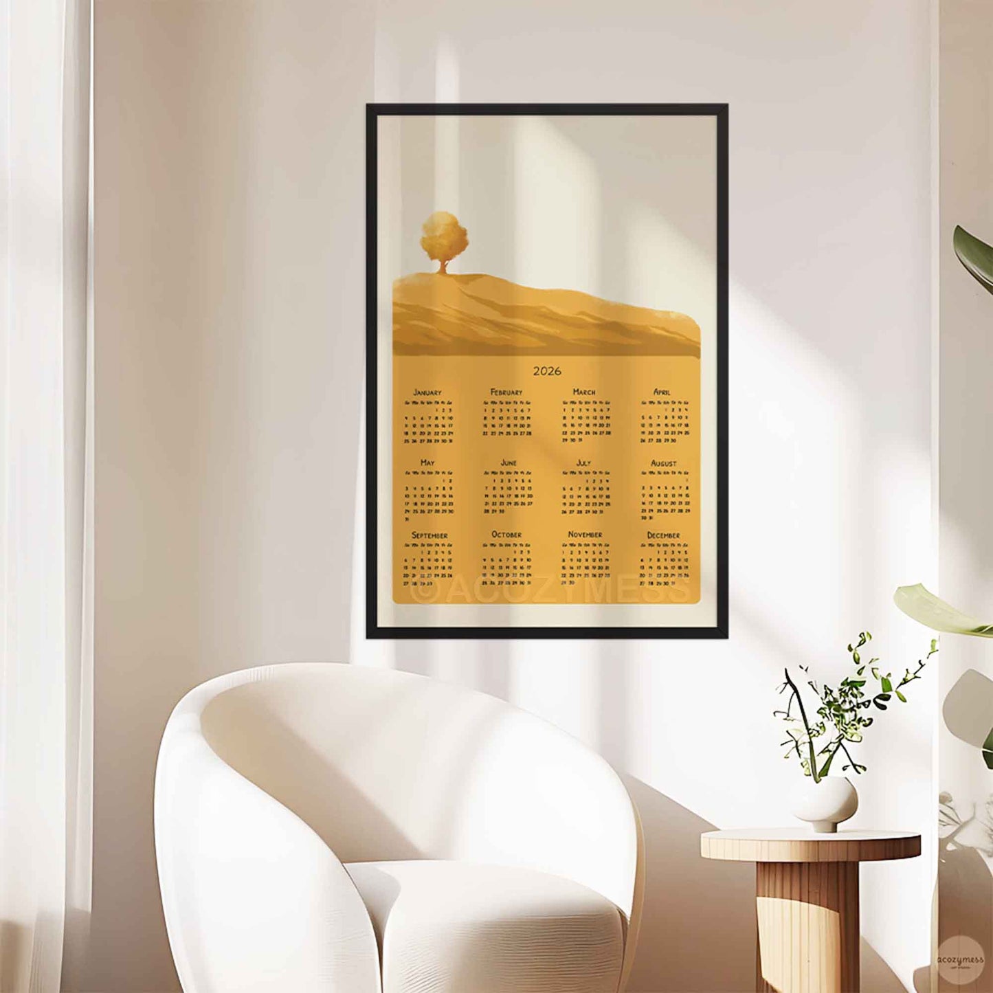 Yearly 2026 calendar with yellow landscape art, displayed in black frame