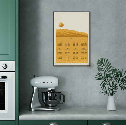 2026 calendar on a kitchen wall with golden yellow tree landscape art
