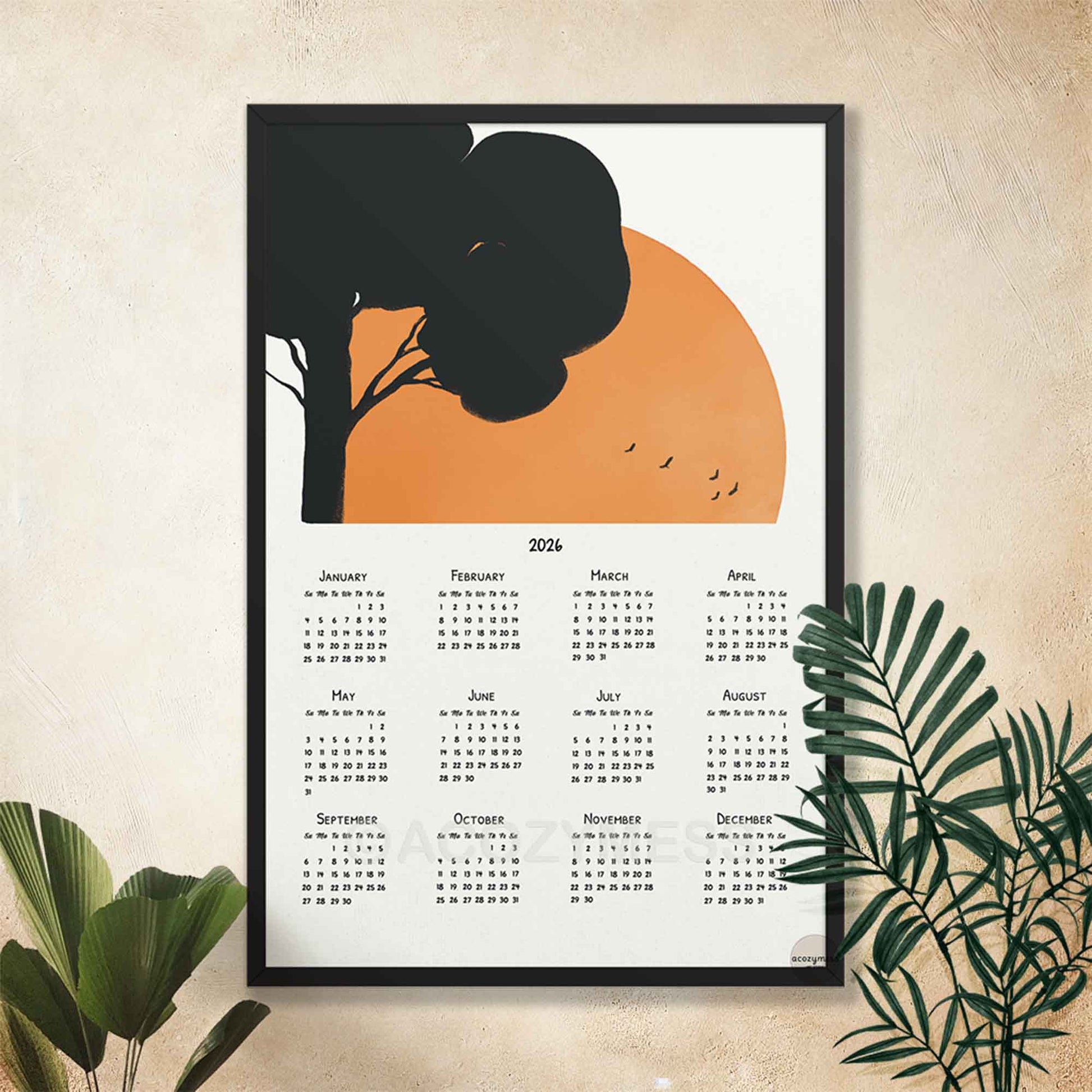 black Framed calendar with tree and sunset design.