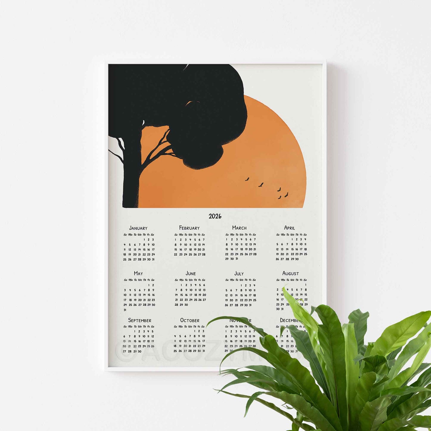 Calendar with a tree and sunrise art.