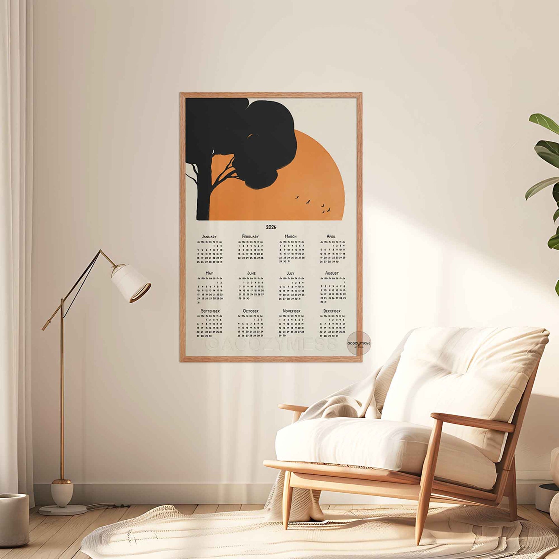 Calendar poster with a decorative design of a tree and sun in a living room setting .