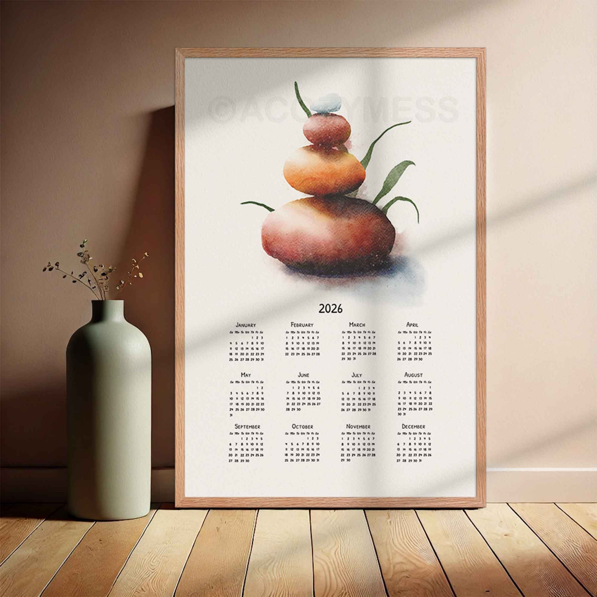 2026 calendar with balancing stones art displayed in wooden frame