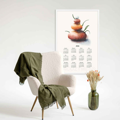 2026 calendar with balancing stones art displayed in white frame