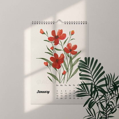 Wall calendar with red floral design on a light gray background