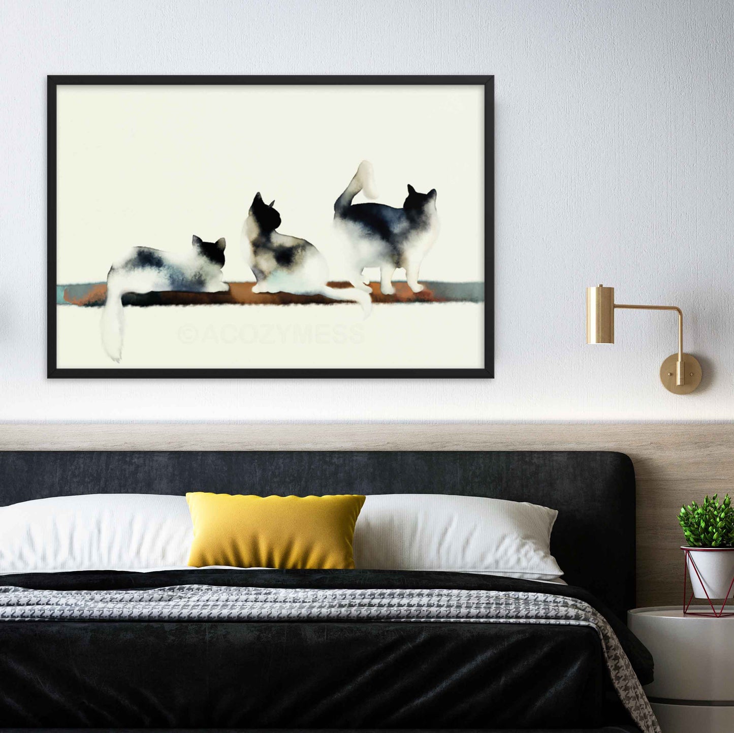 Art print of three cats in black and white with subtle hints of color, capturing a minimalist and elegant aesthetic in black frame