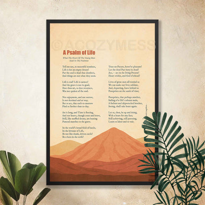 Black framed A Psalm of Life inspirational poem poster on a cream wall with tropical plants