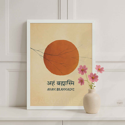 A white framed art print featuring a minimalist orange sun on a beige background with the Sanskrit and English text 'Aham Brahmasmi'.